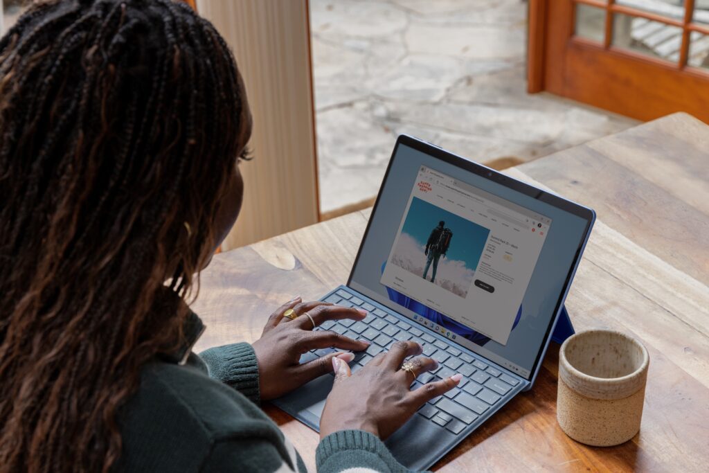 Female blogging on laptop side hustle